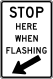 Stop Here When Flashing &mdash; Regulatory sign &mdash; Lane Transitions Signs (MUTCD R8-10)