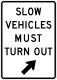 Slow vehicles must turn out &mdash; Regulatory sign &mdash; Regulation of Movement Signs (MUTCD R4-14)