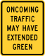 Oncoming traffic may have extended green &mdash; Regulatory sign &mdash; Oncoming Traffic Has Extended Green Signs (MUTCD W25-2)