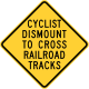 Cyclists Dismount To Cross Railroad Tracks, Hemet, California &mdash; Regulatory sign &mdash; Lane Transitions Signs