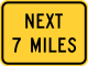 Next (distance) miles (plaque) &mdash; Regulatory sign &mdash; Divided Highways and Hills Signs (MUTCD W7-3AP)